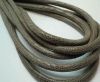 Round stitched nappa leather cord 6mm-LIZARD TAUPE +PAILL. TRANSP